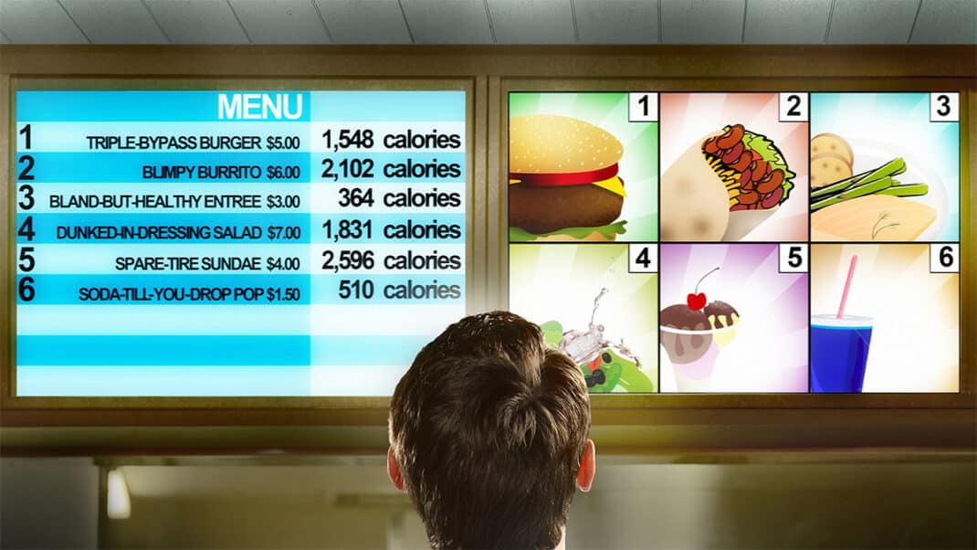 Person looking at calorie counts on menus