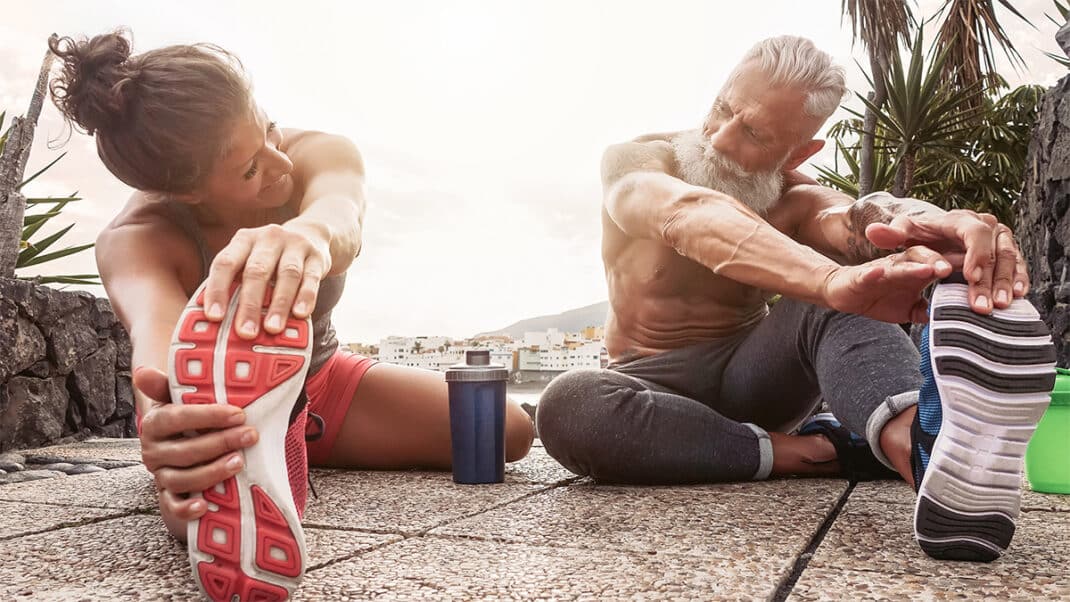 Fit woman and man next to a protein shake