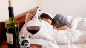 Woman in bed with wine headache