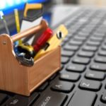 Business strategies toolbox, sitting on top of computer keyboard