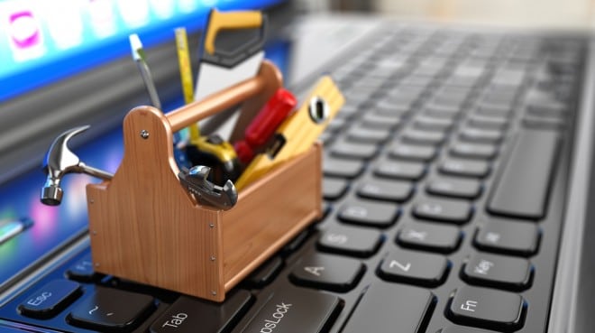 Business strategies toolbox, sitting on top of computer keyboard